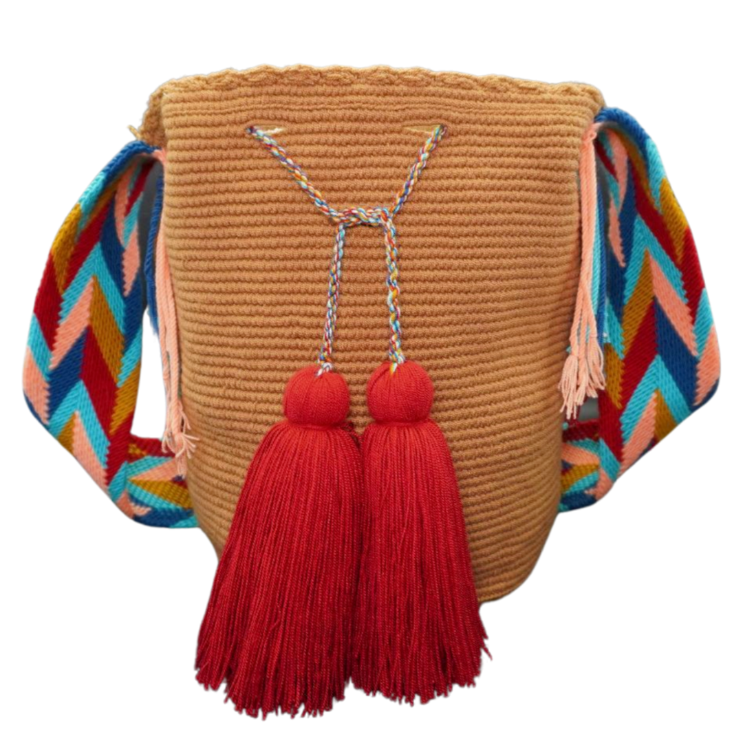 Handmade Caramel Handbag with Patterned Handel. this crochet bag has 2 deep red tassels 