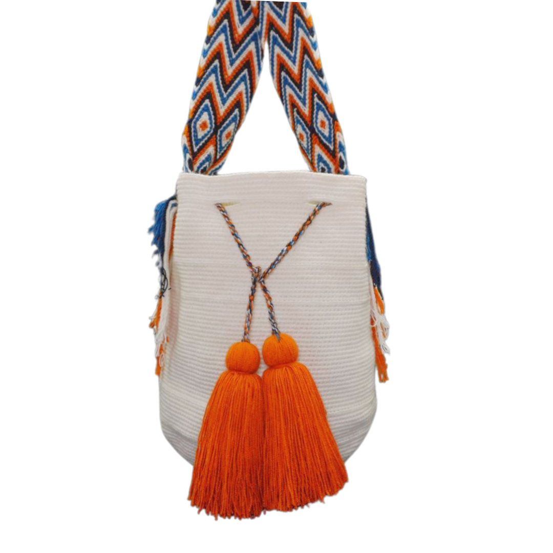 White Mochila with Patterned Handle. The wayuu bag also has 2 tassels in burnt orange