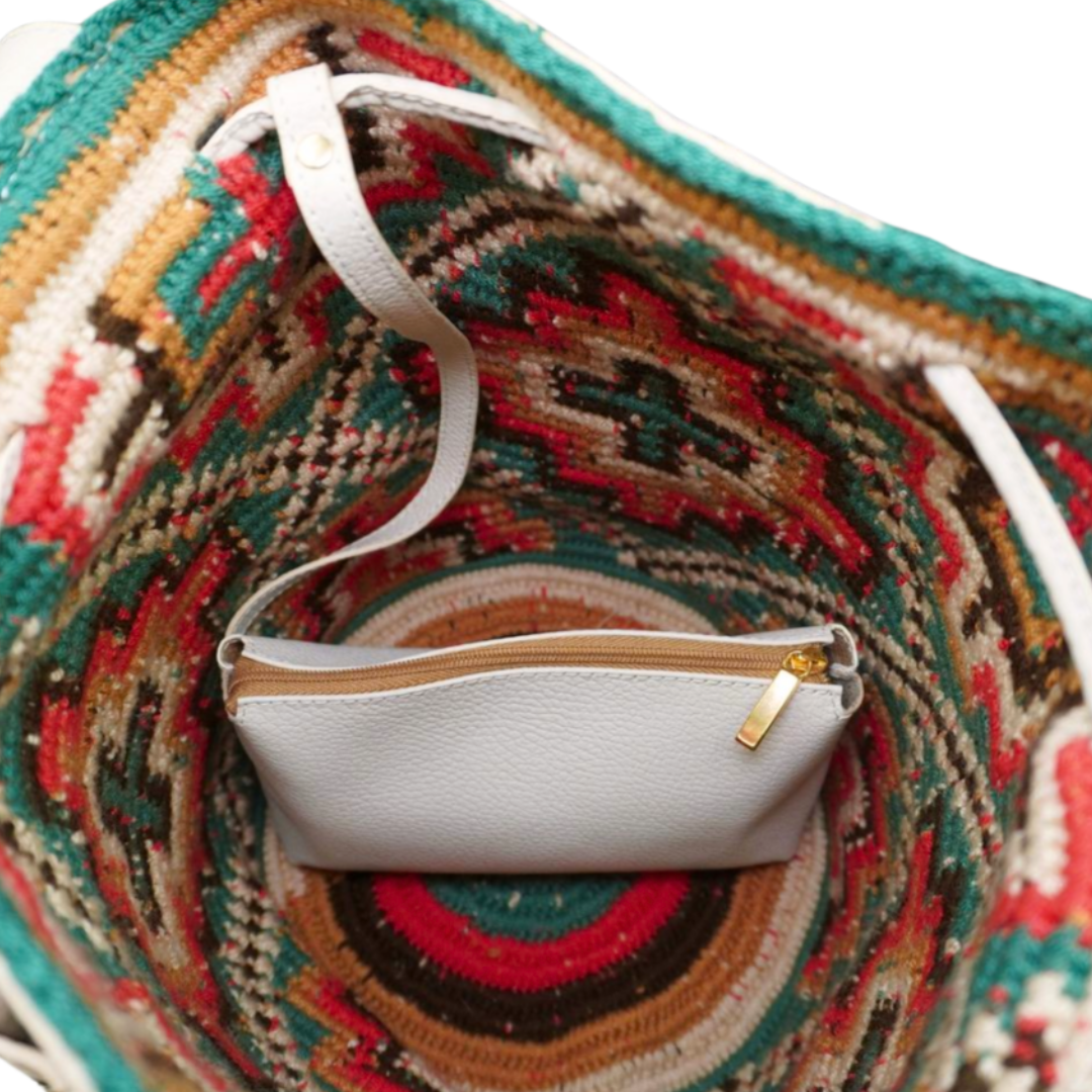 White Leather Wayuu Bag with Multicoloured Gems and two tassels. The mochila has a cross shaped pattern and it has a smaller white leather bag / compartment attached to the bag