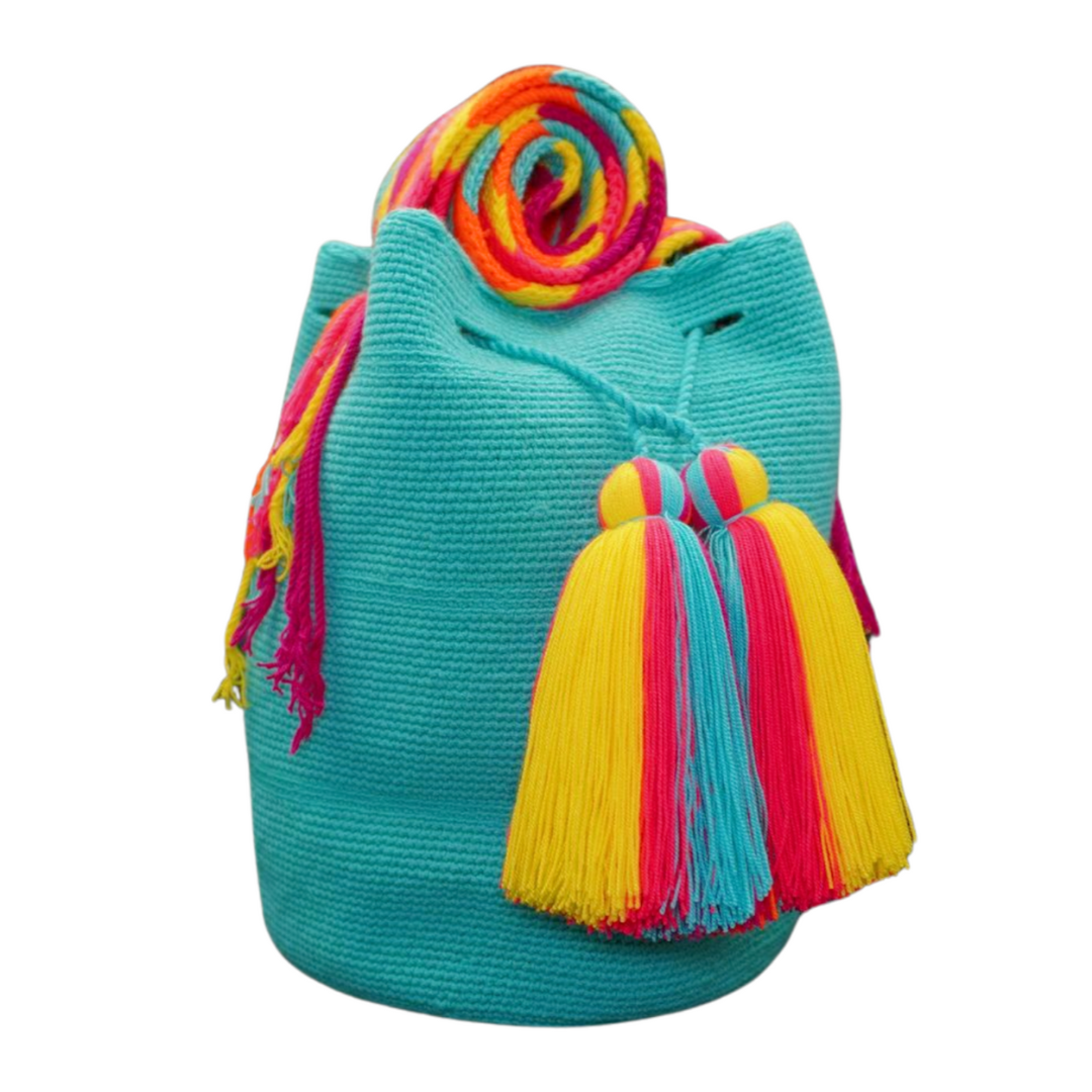 A handmade Danko bag in vibrant aqua, featuring two tassels and a multi-coloured strap. This crochet bag can be worn as a side bag or a crossbody bag